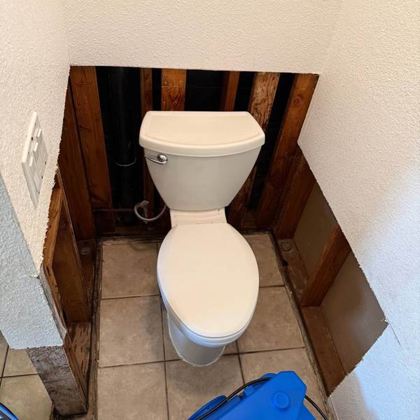 Wall opened behind the toilet for drying